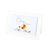 A white greeting card with the words 'Change is beautiful' and a small black line drawing of flowers, featuring a colorful butterfly with glass pebble wings .