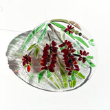 Glass suncatcher featuring vibrant bottle brush flowers