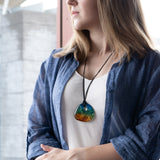 Coastal Lagoon donut pendant on long waxed cotton cord, modelled