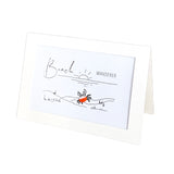 A white rectangular card or print with a simple beach illustration and the words 'Beach WANDERER' in black script and sans-serif text, shown standing on a white background.