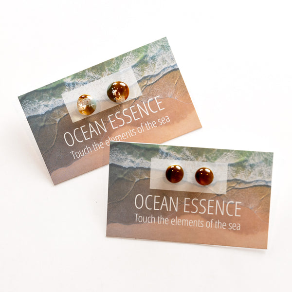 Stud earrings containing grains of beach sand, ethically and thoughtfully sourced from Sydney beaches