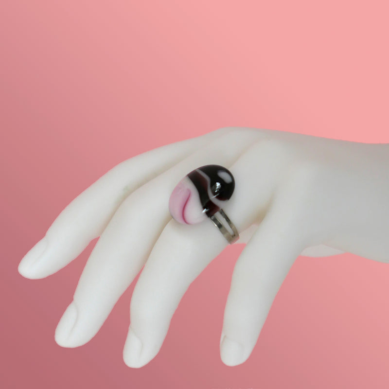 Handmade fused glass ring in shades of pink, purple and dark burgundy