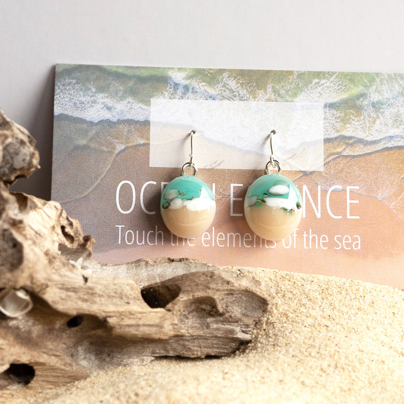 Drop earrings containing grains of beach sand, ethically and thoughtfully sourced from Sydney beaches