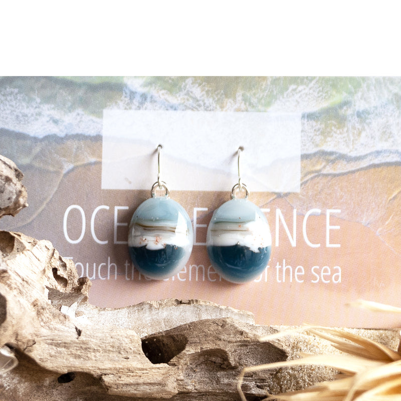 Drop earrings containing grains of beach sand, ethically and thoughtfully sourced from Sydney beaches